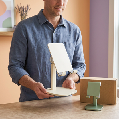 AI concept adult male model holding tablet stand with phone stand nearby